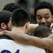 Pioneer senior Tevis Robinson and teammates huddle before the game against Ypsilanti on Monday, March 4. Daniel Brenner I AnnArbor.com